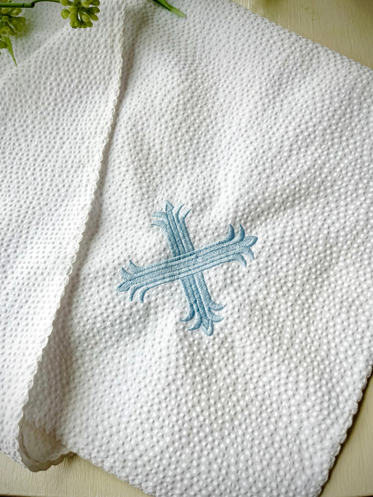 White Baby Blanket with a an embroidered cross design