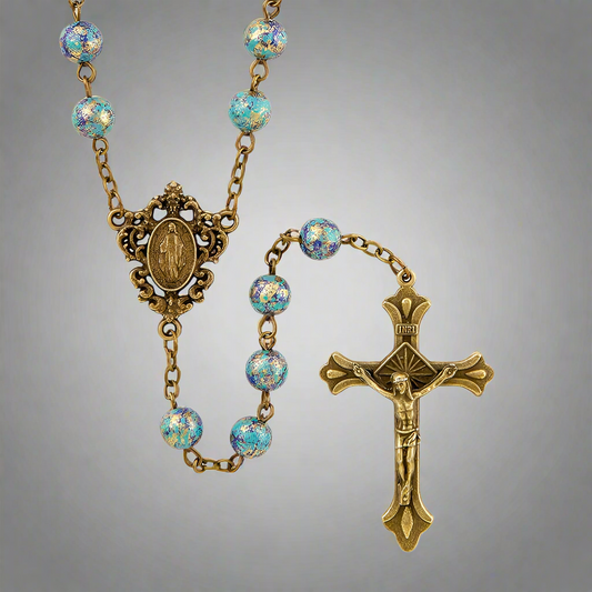 Simple but beautiful gold finish rosary featuring a crucifix and Mary, Mother of Jesus medal with blue beads.